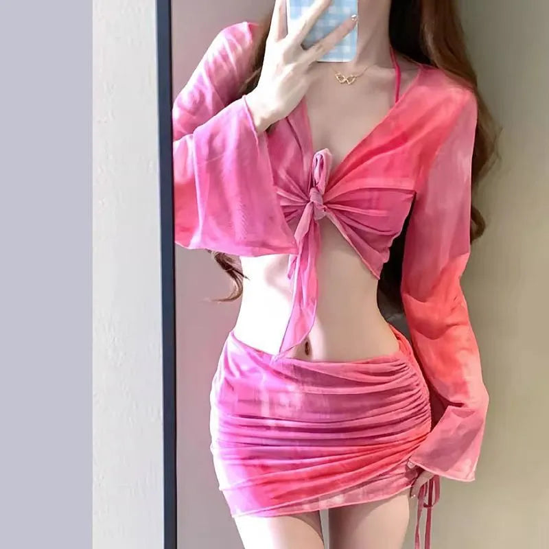 Women's blue high-waist four-piece bikini set with shirt, bra, underwear, and skirt on a mannequin