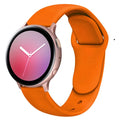 Galaxy Active 2 smartwatch with a purple silicone strap featuring a reverse buckle clasp.