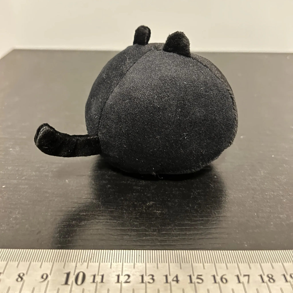Black cat plush stuffed animal toy measuring 4 inches across