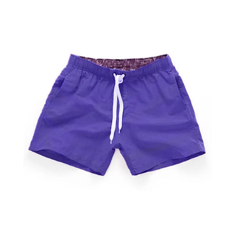 Men's straight leg beach shorts in polyester available in multiple colours and plus sizes.