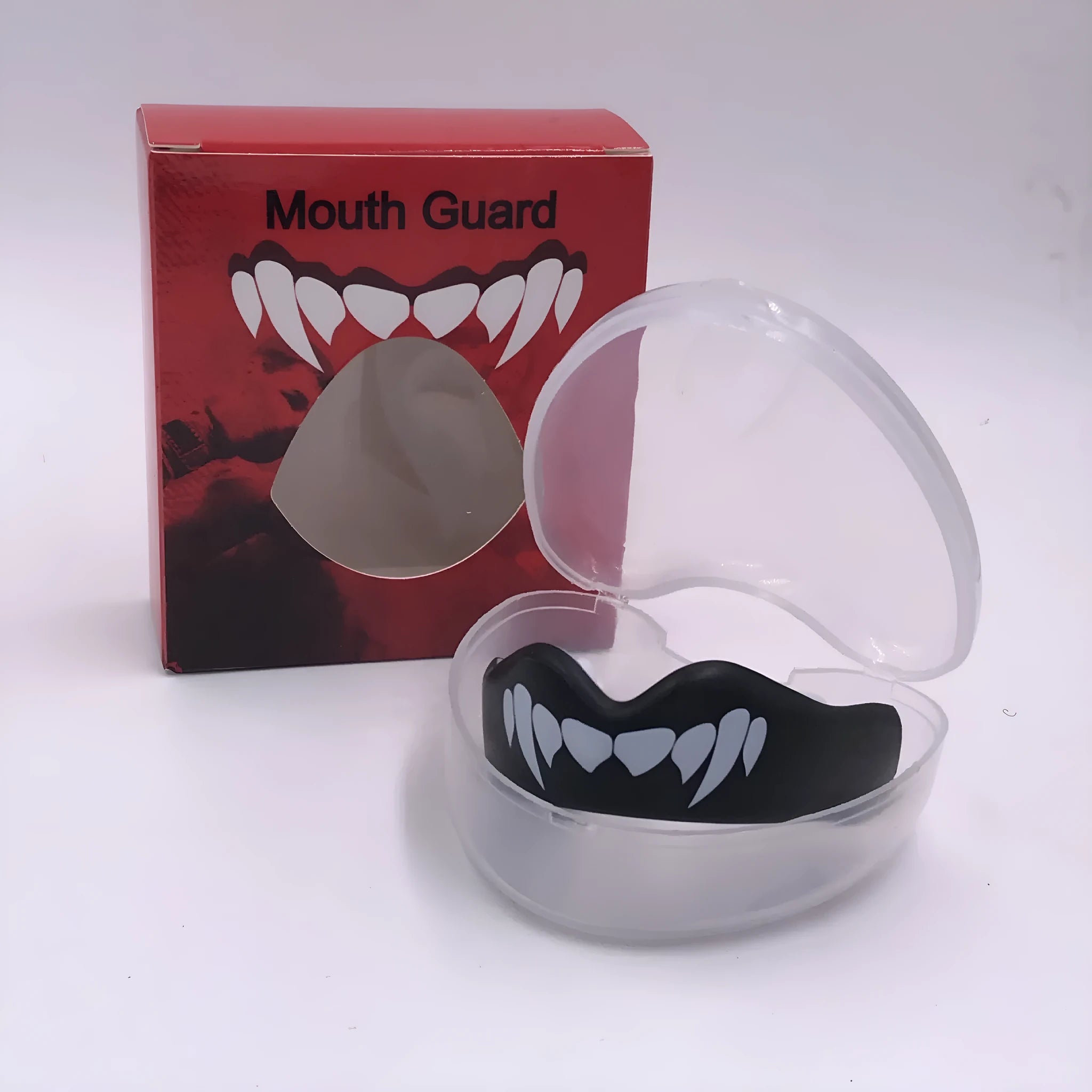 Adult boxing mouthguard with printed tooth design in black and white, for martial arts and fight sports.