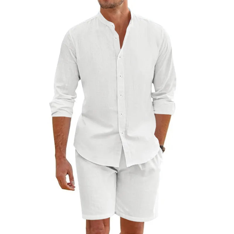 Man wearing a dark grey short-sleeve lapel shirt and matching drawstring shorts from a hemp-blend linen summer suit set.
