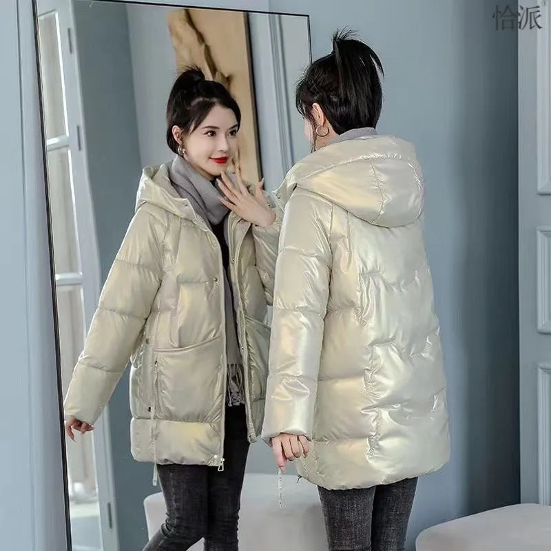 Women's loose thick hooded winter jacket in acrylic fabric on a hanger