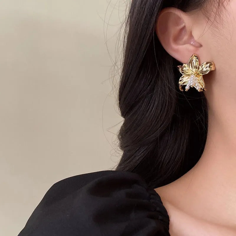 Gold floral pearl earrings with exaggerated design and Seiko-treated metal construction