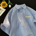 Blue striped plus size loose half sleeve shirt on hanger