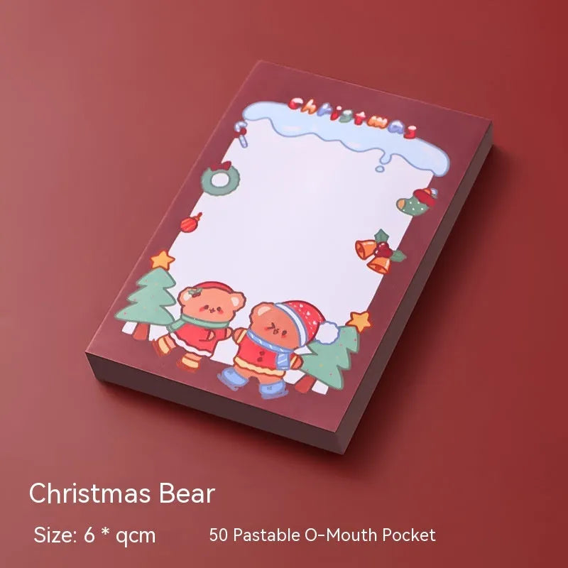 Christmas cartoon sticky notes pad showing eight festive designs including Santa Claus, snowman, and Christmas elf