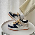 Men's low cut solid colour white casual sports board shoe with PU upper on display
