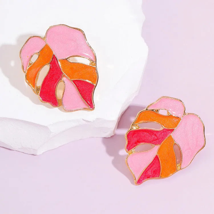 Maple leaf stud earrings with handmade drop oil finish, electroplated alloy, available in green or pink.