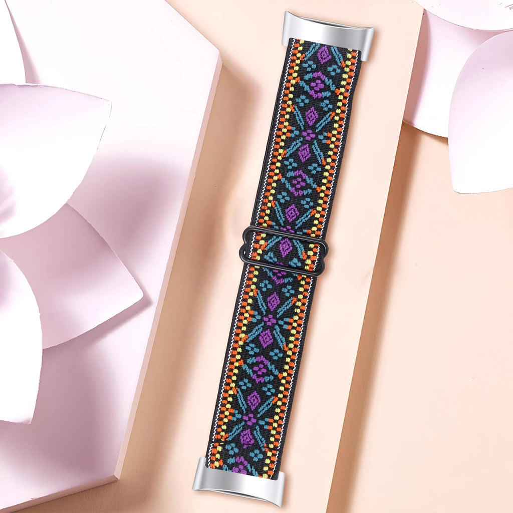 Printed elastic watch strap for Fitbit Charge 6 showing rainbow pattern design
