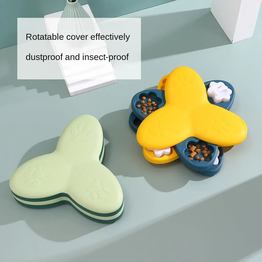 Green and yellow dog puzzle toy with rotatable treat dispenser and nine bone-shaped compartment covers