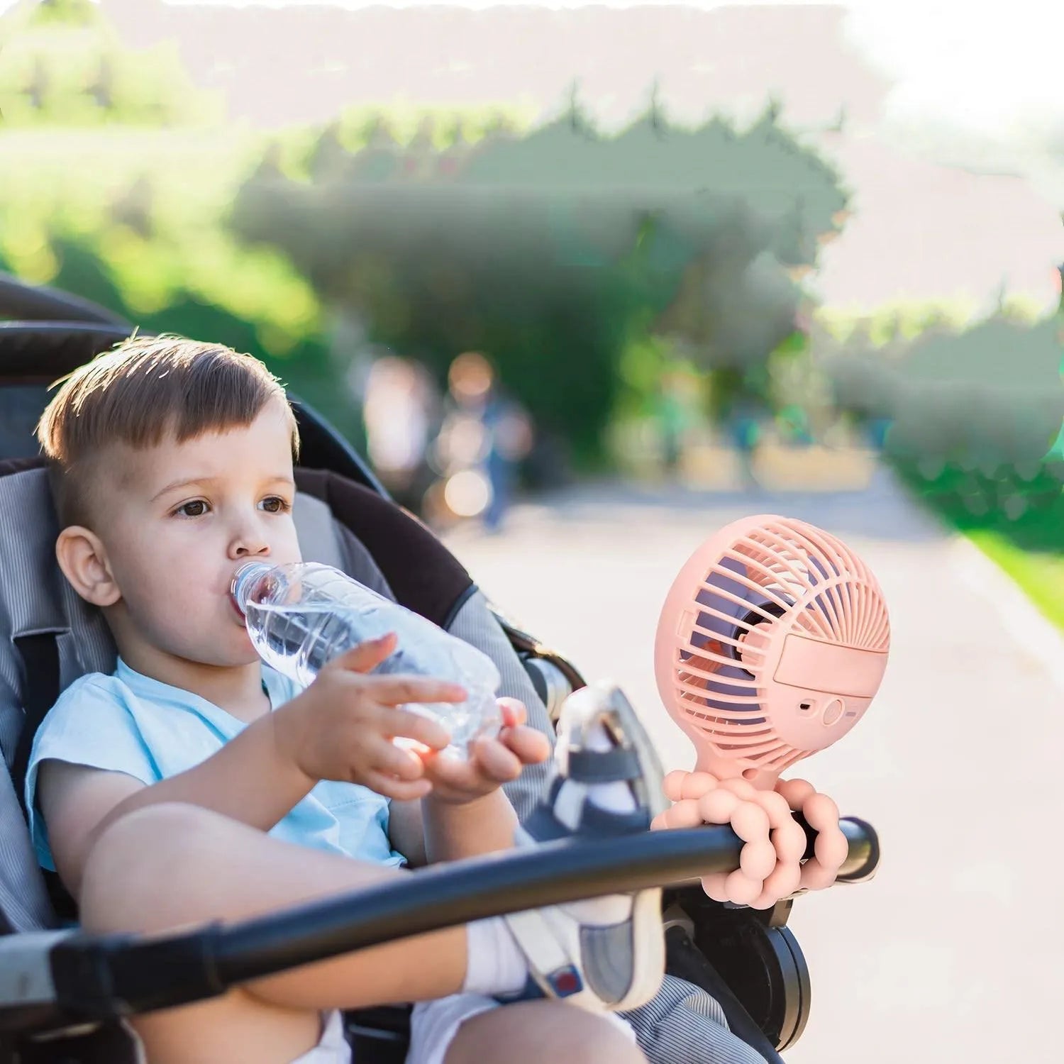 Pink portable stroller fan with octopus design, flexible clip, and LED night light