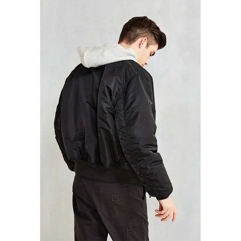 Men's army green loose-fitting nylon pilot jacket with cotton padding from American workwear collection.