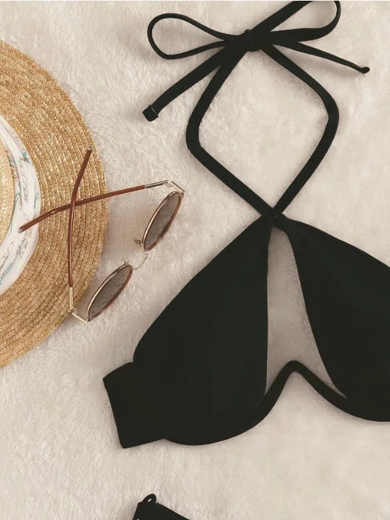 Women's brown halter bikini top and briefs on a neutral background.