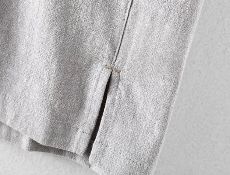 Men's loose-fit cotton linen casual shirt in a solid colour, shown on a hanger.