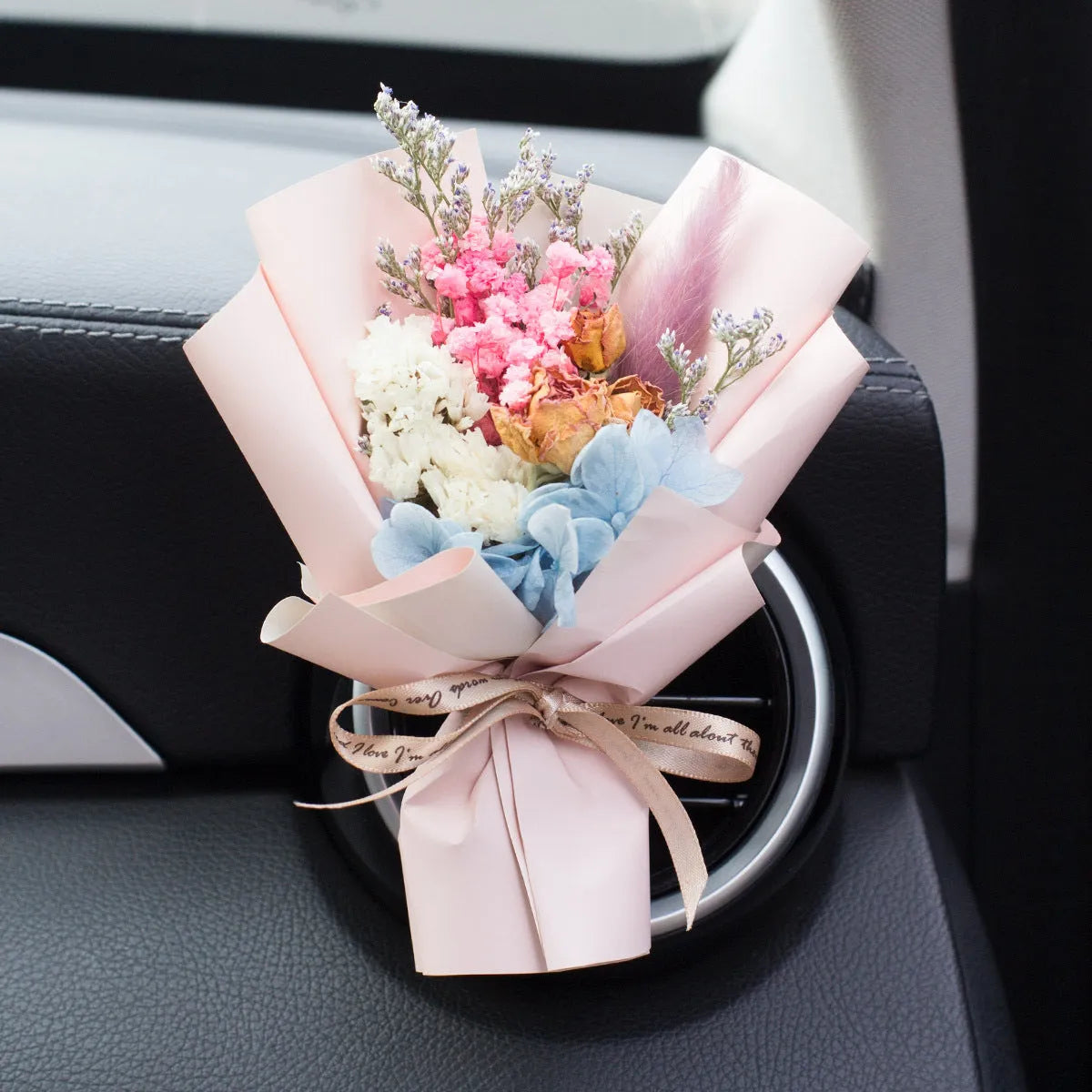 Handmade dried flower car air freshener ornament in multiple colours mounted on car vent