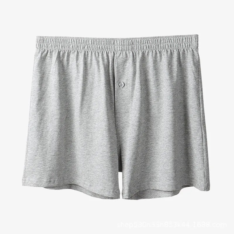 Men's solid colour cotton boxer shorts with a high waist and loose fit.