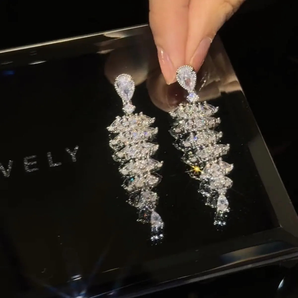 Zircon Christmas tree drop earrings with silver pagoda colour finish on copper construction