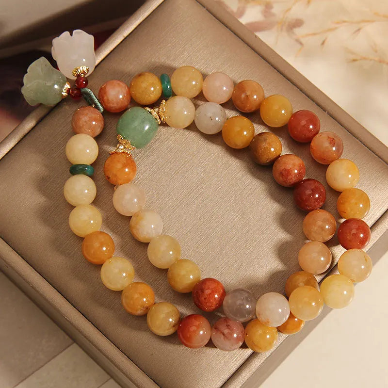 Women's natural jade multi-layer bracelet with orchid pendant on wrist