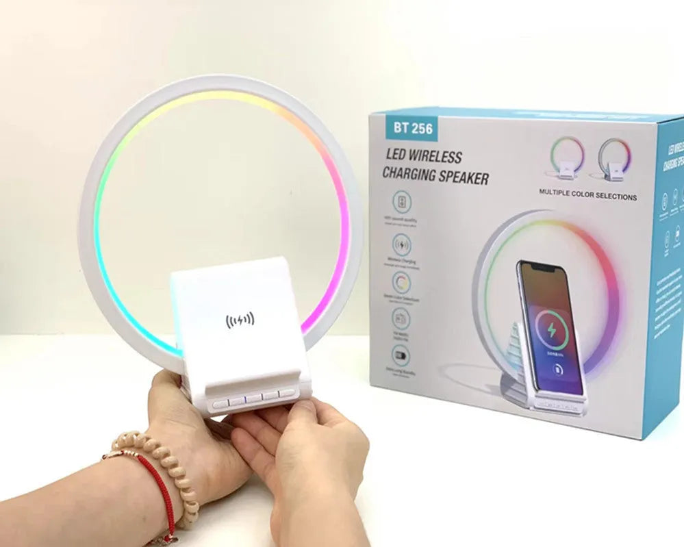White rectangular Bluetooth speaker with wireless charging surface and ambient lighting