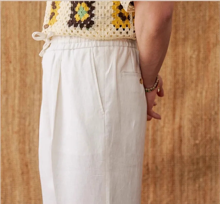 Straight-leg linen trousers with elasticated high waist in greige, navy blue, and white colours