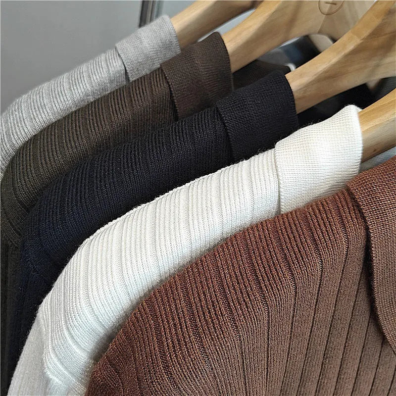 A boys' loose striped pullover sweater with a lapel collar, shown in a light grey colour.