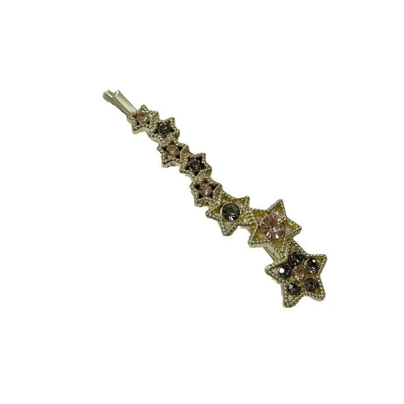 Gold electroplated rhinestone barrettes with side clip design featuring star and letter charms