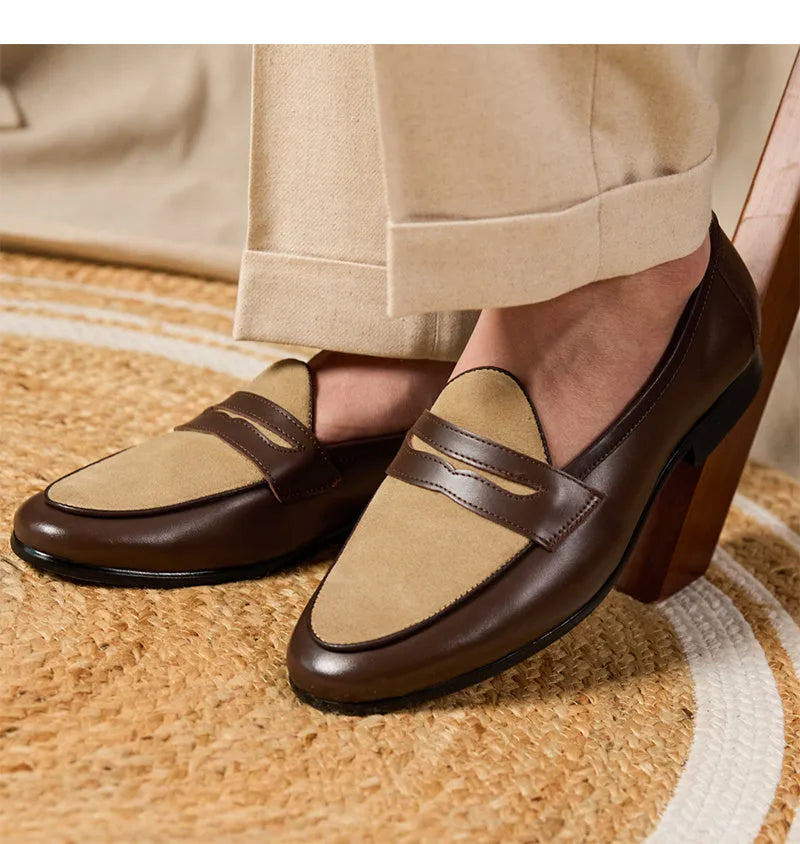 Coffee grey suede leather loafers with an elastic kick tab closure and a rubber sole.