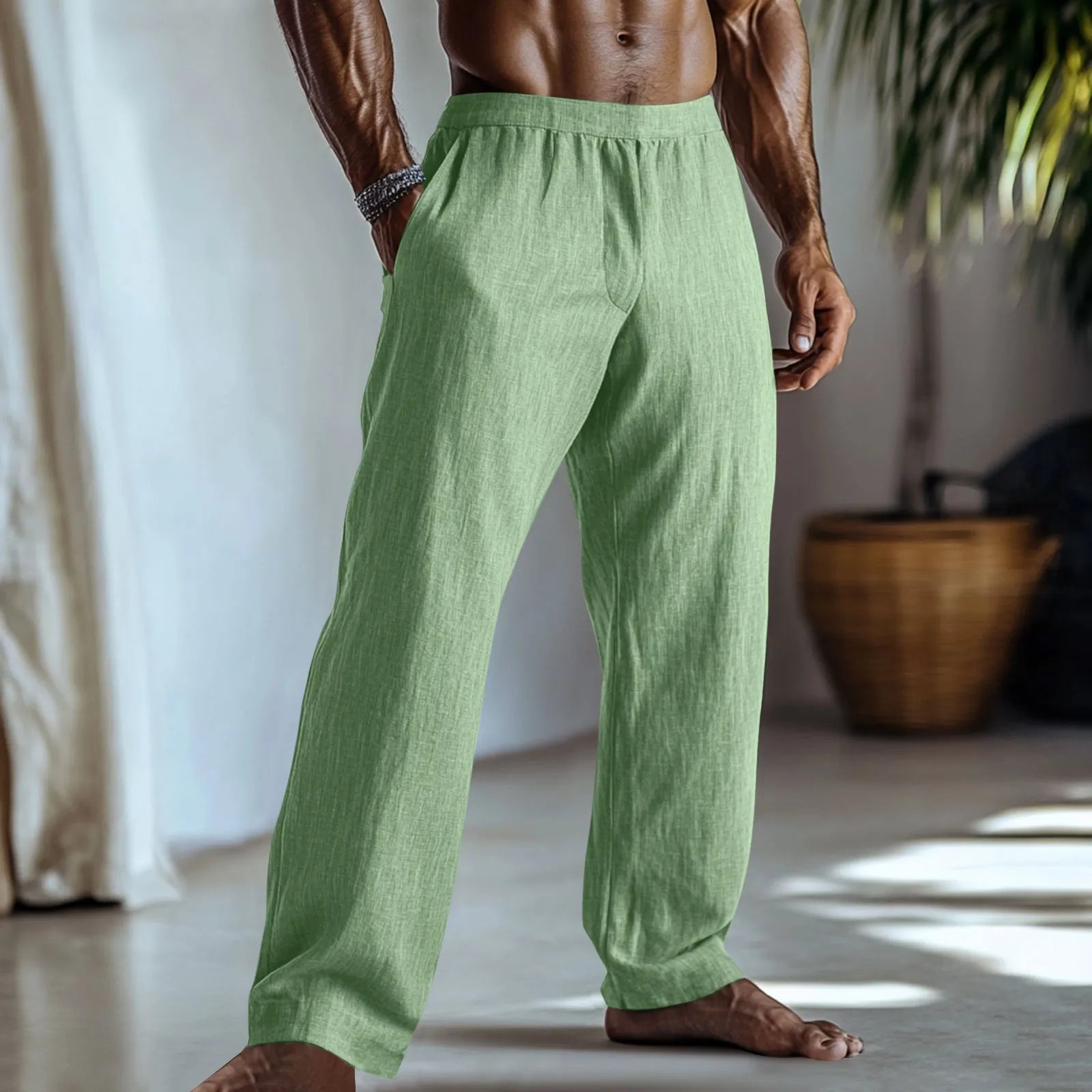 Straight-leg cotton and linen casual trousers in a light green colour, shown with visible pockets.