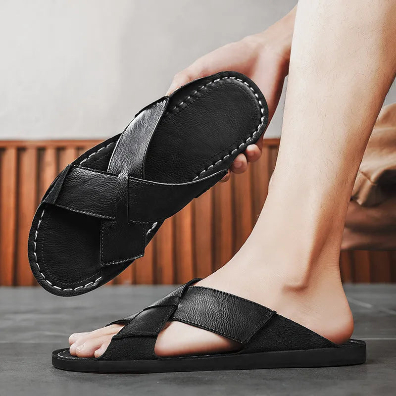 Men's black genuine pigskin leather slip-on sandals with a frosted finish and rubber sole.
