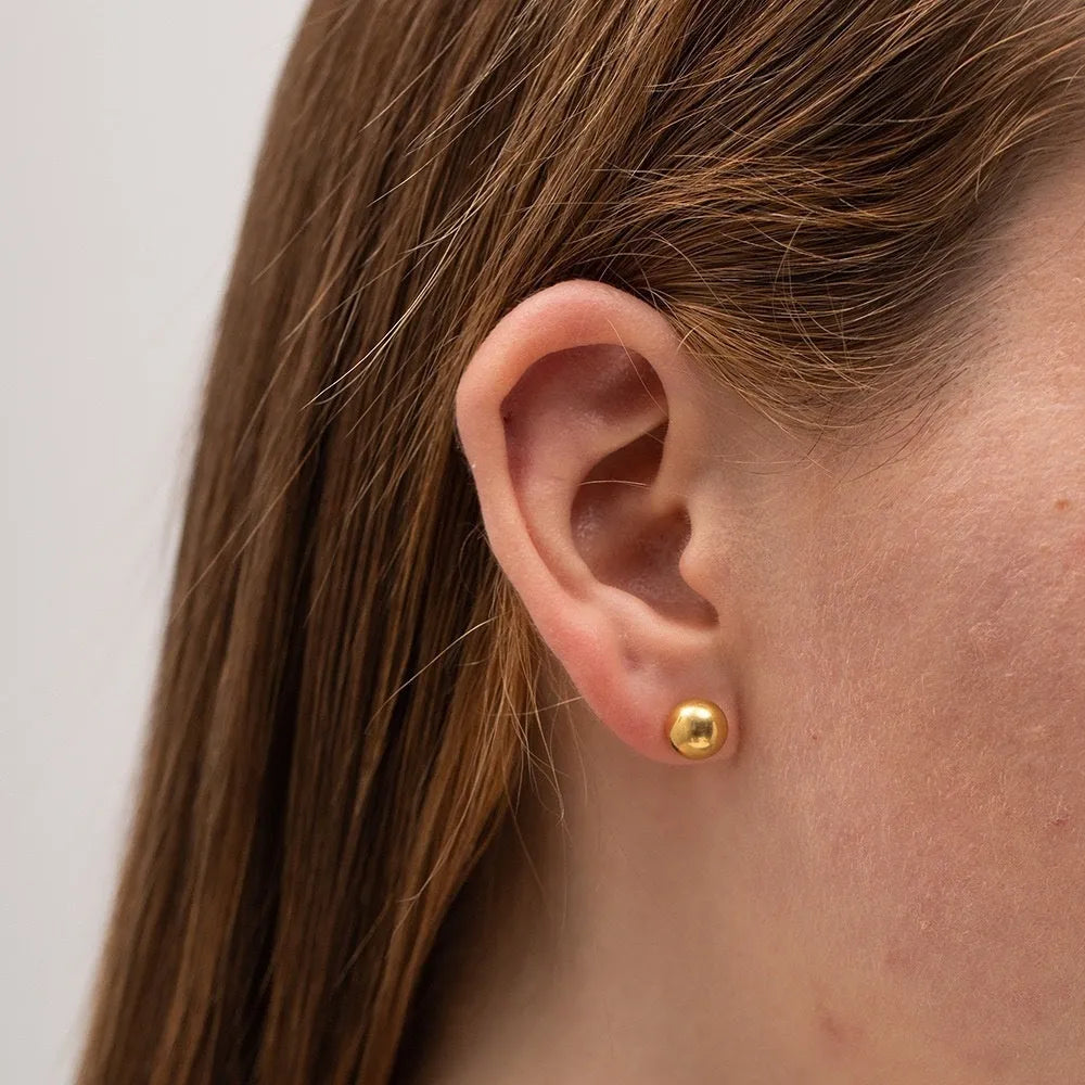 Stainless steel round ball stud earrings in gold or silver, showing 3mm, 4mm, 5mm, and 6mm size options.