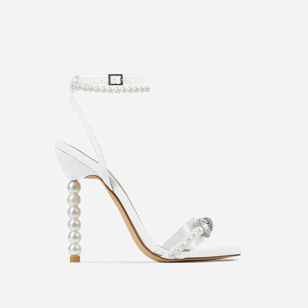 Women's square toe stiletto heel shoes with rhinestone bow and pearl strap in pink colour