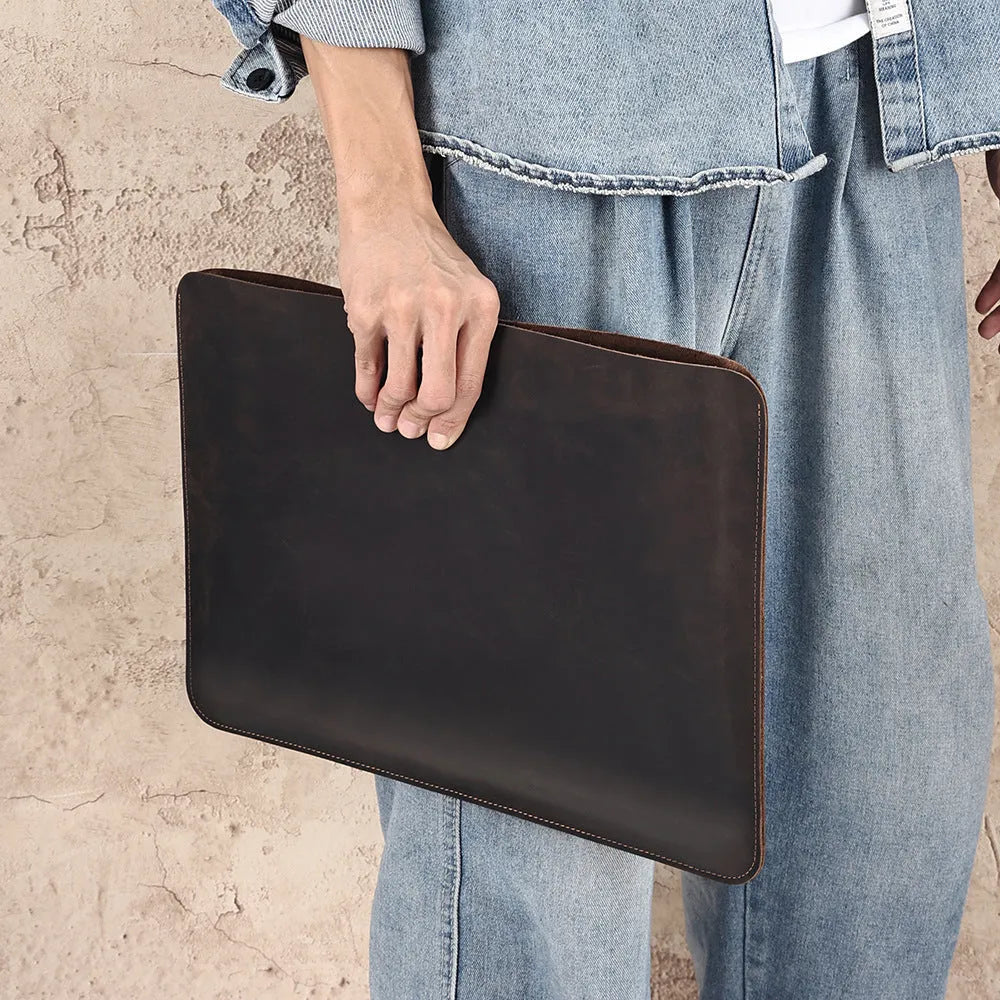 Crazy Horse leather horizontal computer liner bag in brown showing first layer cowhide construction