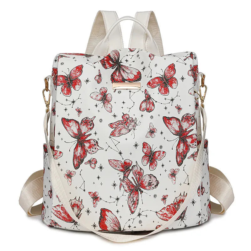 Butterfly print backpack with sewing line detail shown in multiple colour options