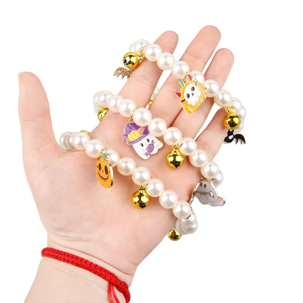 Halloween cat collar with pearl necklace decoration showing three pumpkin design variations