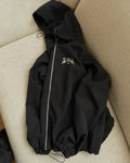 Men's loose fit hooded sunscreen jacket in polyester fabric shown in black colour with British style detailing