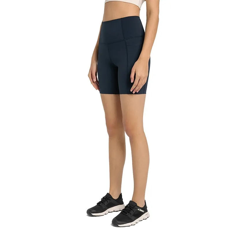Women's short-length sports shorts in cotton blend fabric shown in black, for running and fitness activities.