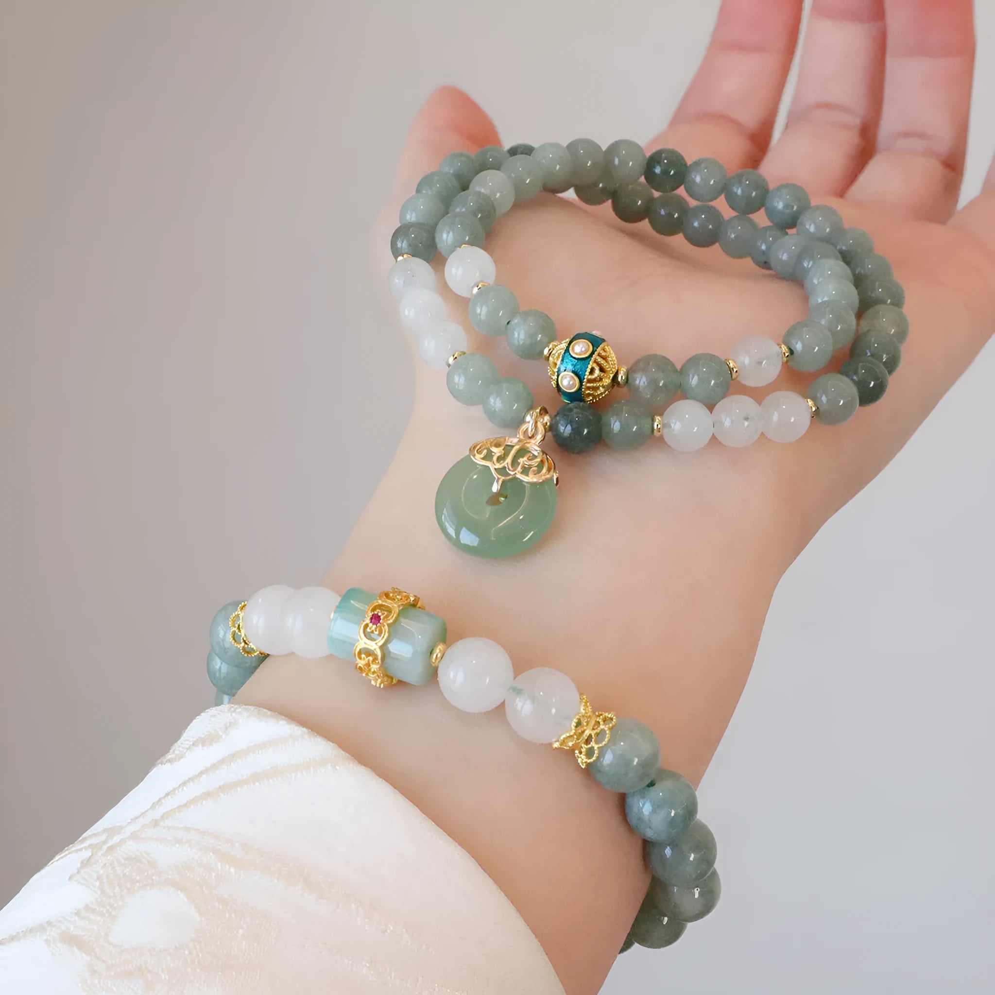 Myanmar jade safety buckle bracelet with geometric peace buckle charm on wrist