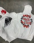 Black loose hooded sweatshirt with white printed skull and rhinestone detail, cardigan style.