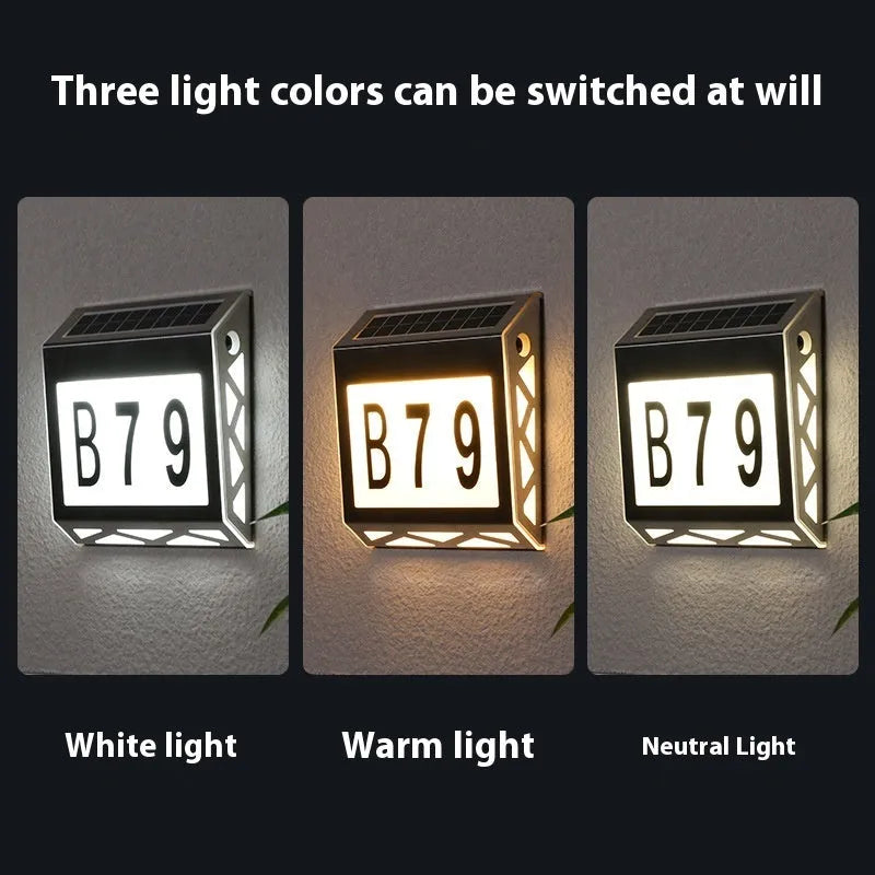 Black solar-powered doorplate light with LED digital numbers for outdoor house address illumination