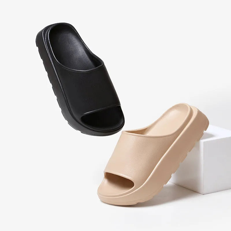 Women's beige thick-soled EVA slippers with a 5.5cm platform, shown from the side.
