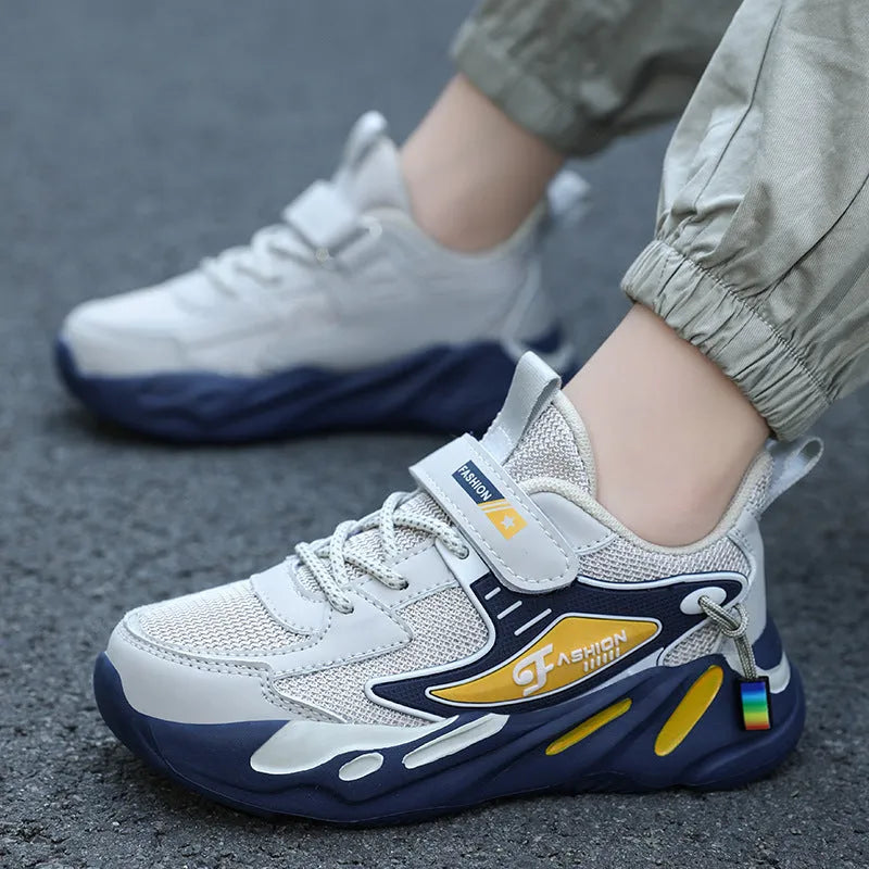 Boys' dark blue and light blue sports running shoes with Velcro strap and mesh upper.