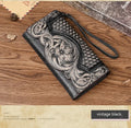 Chinese-style floral embossed tri-fold leather wallet in retro brown showing opened compartments