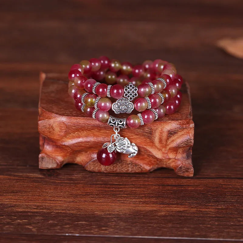 Handmade watermelon crystal Chinese knot bracelet with traditional geometric designs in 8mm and 6mm elephant style sizes