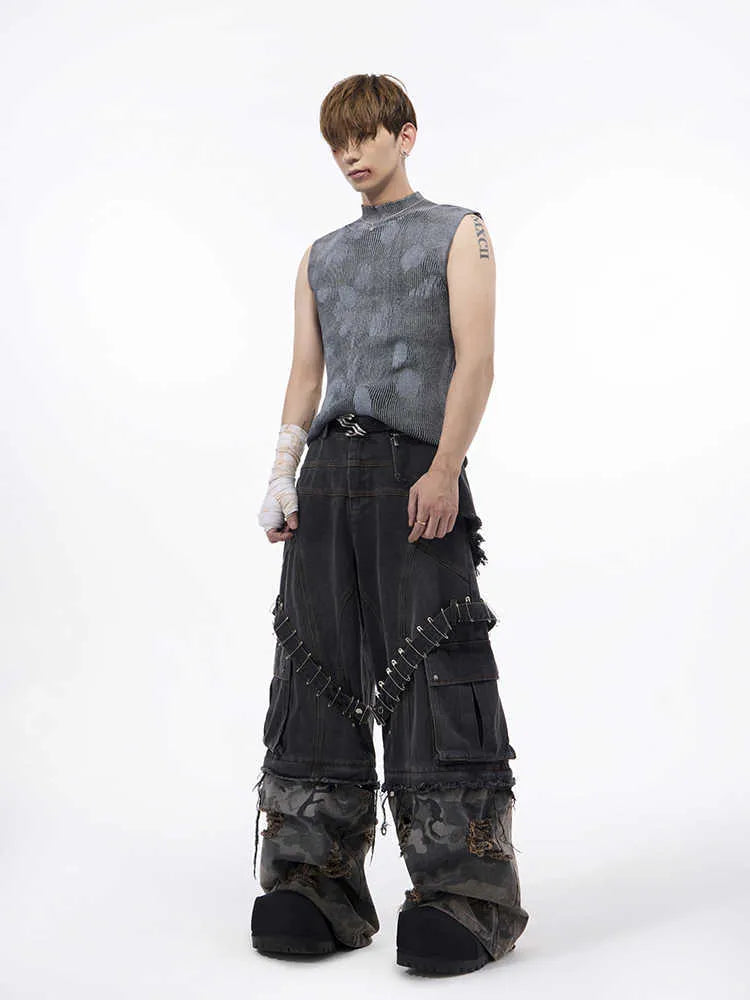 Men's black silver pastebrushing wool sleeveless top with turtleneck collar on mannequin