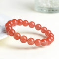 Natural South Red Cherry Agate bracelet showing polished beads in a single circle design.