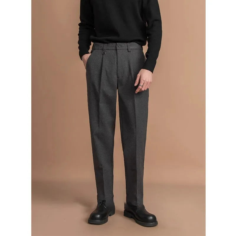 Men's straight-leg suit trousers in a draped fit, shown in a neutral colour.