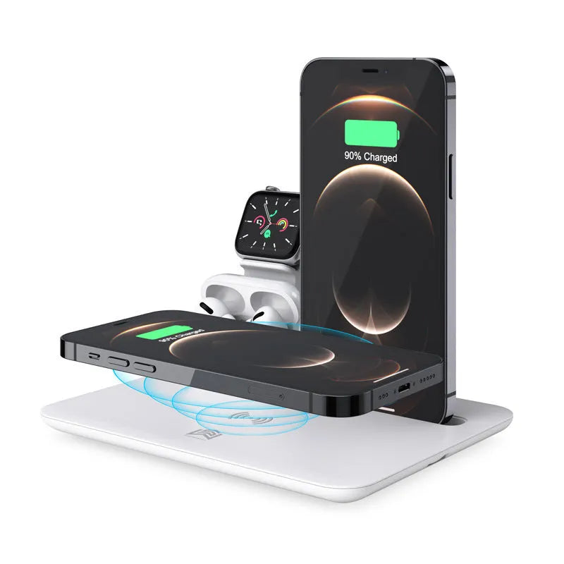 Black and white wireless charging station for mobile phone, smartwatch, and headphones on a desk.