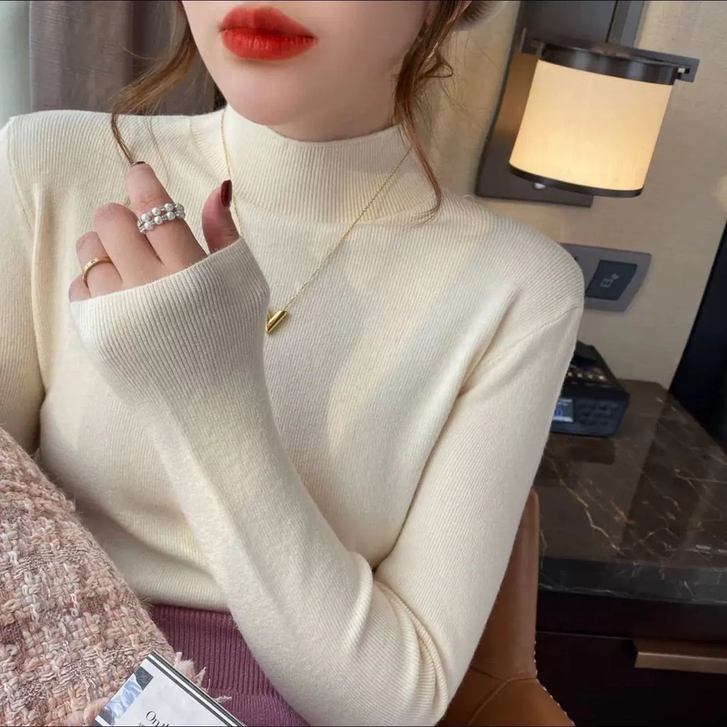 Women's slim fit knitted top in viscose fibre with long sleeves available in eight colours