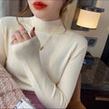 Women's slim fit knitted top in viscose fibre with long sleeves available in eight colours