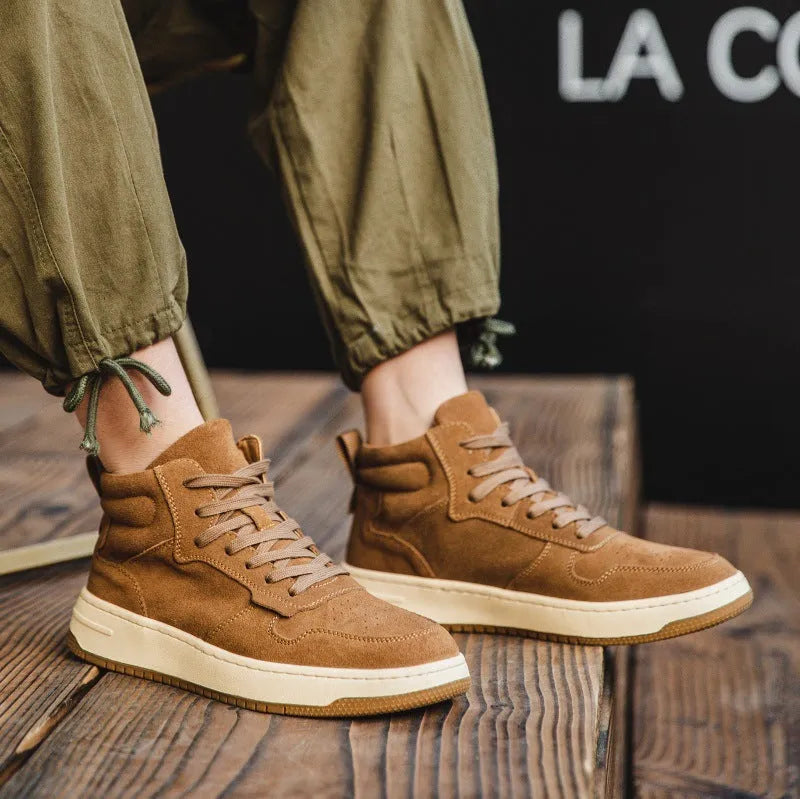 Men's retro workwear mid-top Martin boots in brown cowhide with lace-up closure and flat heel on neutral background